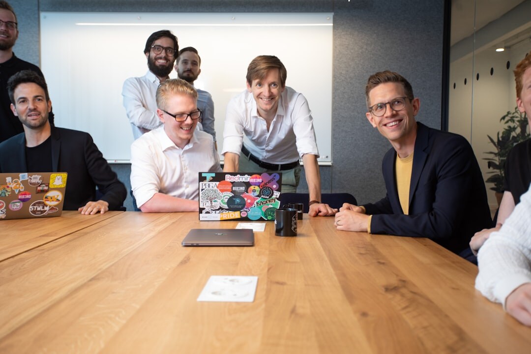 Belgian media training team meeting around a table